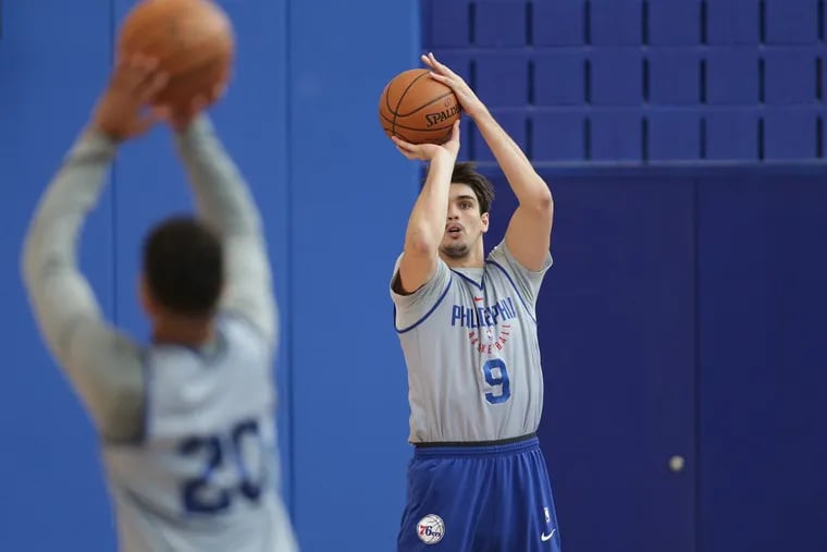 Sixers’ Dario Saric, right, takes a shot at the Sixers Training Complex in Camden, N.J. on April 13, 2018.