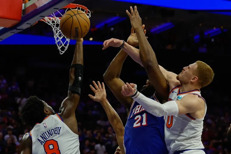 The Knicks' Donte DiVincenzo attempts to block the shot of Sixers center Joel Embiid in Game 6 of their first-round series.