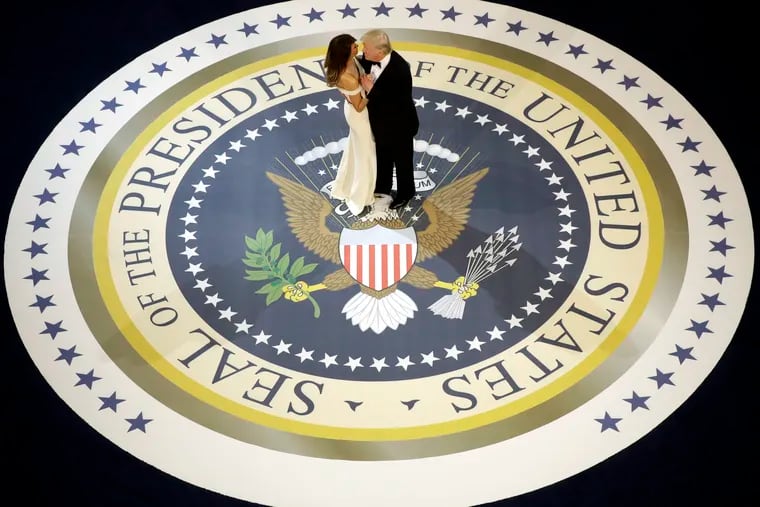 FILE - In this Jan. 20, 2017, file photo, President Donald Trump dances with first lady Melania Trump at the Salute To Our Armed Services Inaugural Ball.