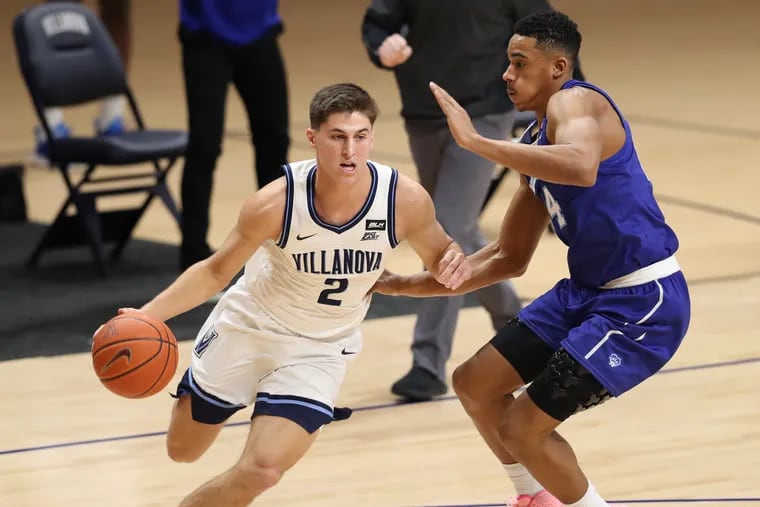 Collin Gillespie of Villanova drives against Jared Rhoden of Seton Hall during the first half.