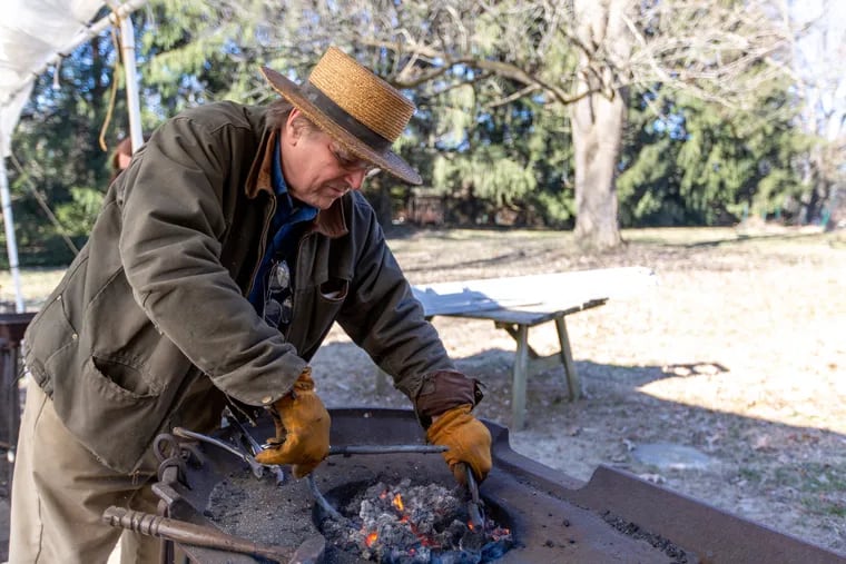 Bruce Cooper Gill, executive director and Curator of The Harriton Association, demonstrates blacksmithing at Harriton House in Bryn Mawr, Saturday, February 9, 2019. The Harriton House Association hosts classes with a historical twist including beekeeping, bookbinding, and blacksmithing.