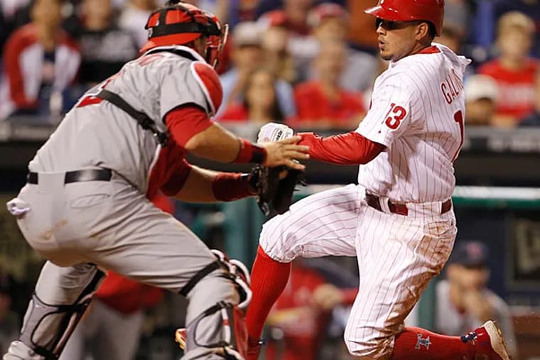 Freddy Galvis is tagged out at home plate. (Ron Cortes/Staff Photographer)