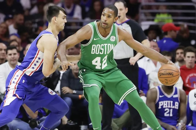 Celtics forward/center Al Horford dribbles against Dario Saric in an October game. These are two vastly different teams since then.