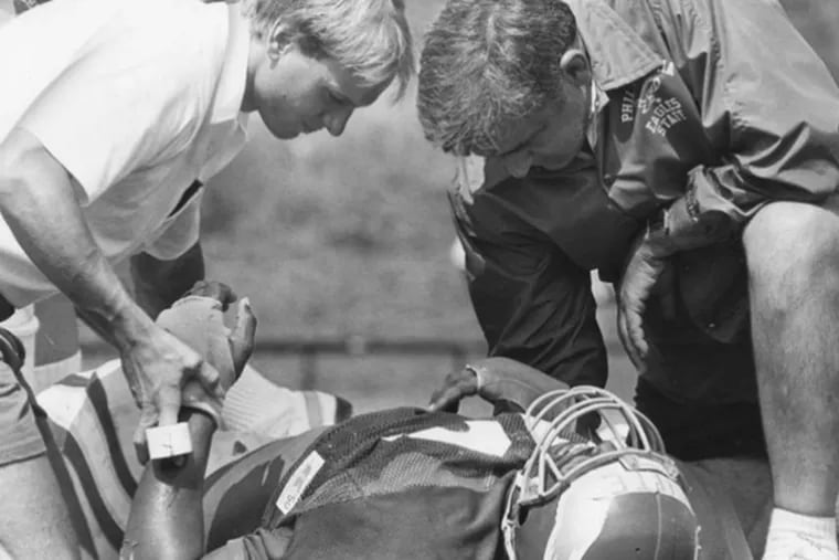 (FILE PHOTO Even the great Reggie White collapsed during Buddy Ryan's brutal first camp.)
