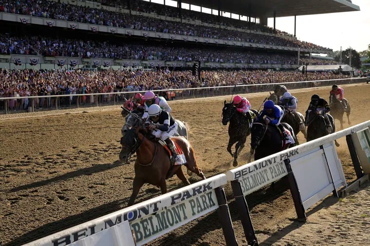 In this June 8, 2019 photo, Sir Winston (7), with jockey Joel Rosario up, crosses the finish line to win the 151st running of the Belmont Stakes.