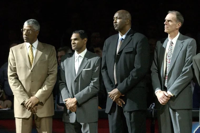 Hall of Famers (from left) Julius Erving, Maurice Cheeks, Moses Malone and Bobby Jones, standing at midcourt during half-time  ceremonies celebrating a reunion of members of the 76ers' 1982-1983 NBA championship team on March 14, 2003.