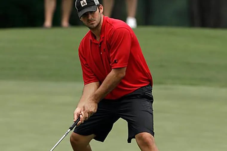 Dallas Cowboys quarterback Tony Romo watches his birdie putt drop in the cup during sectional qualifying for the 2010 U.S. Open. (AP Photo/David J. Phillip)