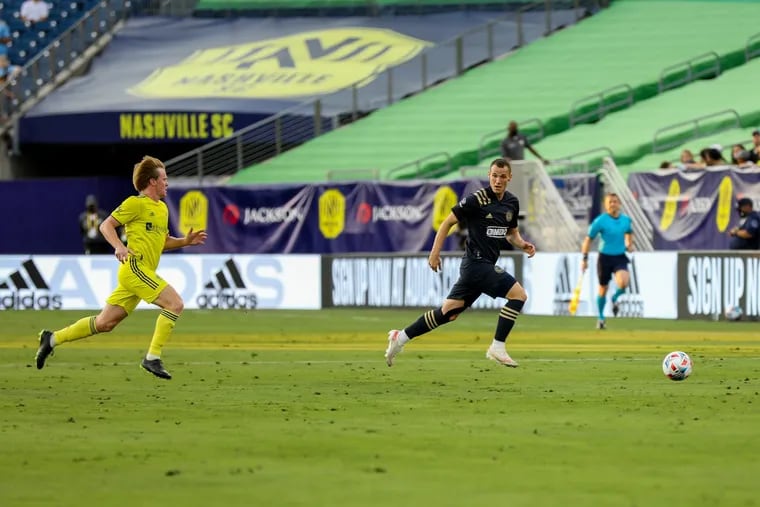 Dániel Gazdag (right) tries to keep the ball from Dax McCarty during the Union's game against Nashville.