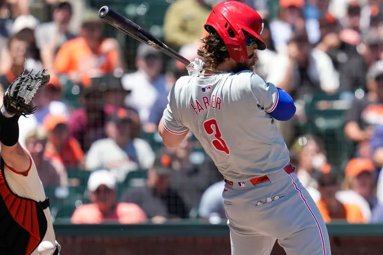 A high and tight pitch nicked the knob of Bryce Harper’s bat, knocking him back, and causing his helmet to fall off and crack on the ground against the Giants in the fourth inning.