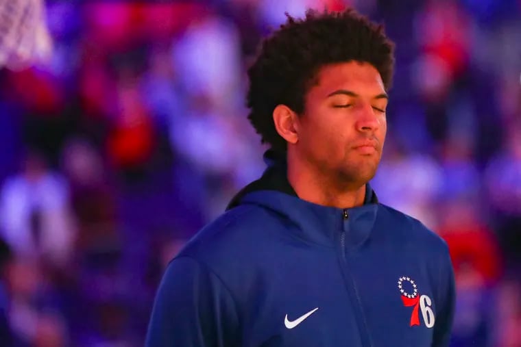 Philadelphia 76ers guard Matisse Thybulle (22) closes his eyes during the national anthem before a game between the Sixers and Pacers at the Wells Fargo Center in Philadelphia .