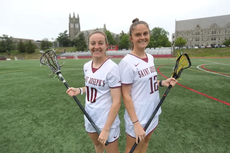 St. Joseph's lacrosse players Rebecca Lane (left) and Stephanie Kelly grew up as friends in Australia.