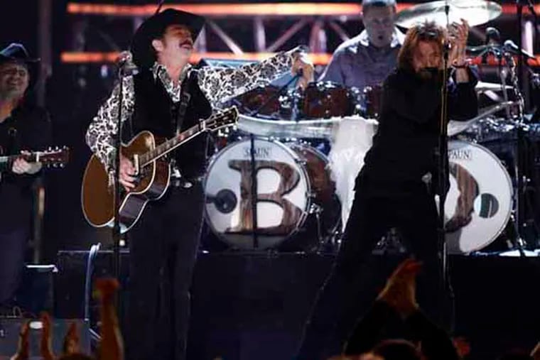 Kix Brooks, left, and Ronnie Dunn, of Brooks and Dunn perform at the 45th Annual Academy of Country Music Awards in Las Vegas on Sunday, April 18, 2010.