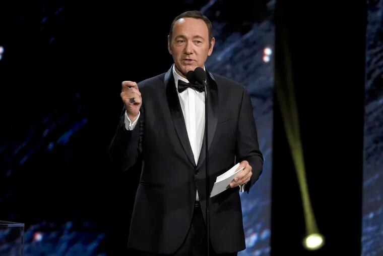 FILE - In this Oct. 27, 2017, file photo, Kevin Spacey presents an award in Beverly Hills, Calif. A Massachusetts prosecutor says Spacey is scheduled to be arraigned Jan. 7, 2019, on a charge of indecent assault and battery for allegedly sexually assaulting the teenage son of a Boston television anchor in a Nantucket restaurant. (Photo by Chris Pizzello/Invision/AP, File)