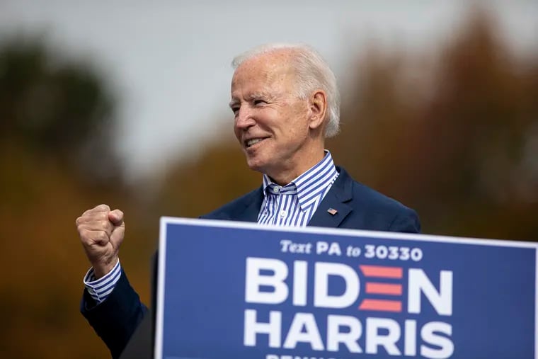 Democratic Presidential Candidate  Joe Biden pumps his fist during the drive-in event at Bucks County Community College.