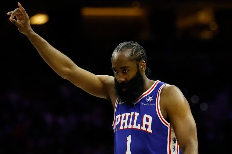 Sixers guard James Harden raises his arm against the Cleveland Cavaliers on Friday, March 4, 2022 in Philadelphia.