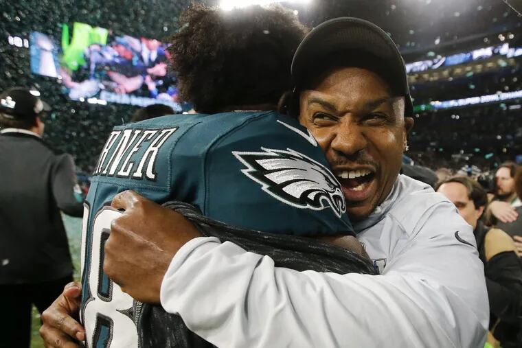 Eagles running back Darren Sproles celebrates with teammate running back Kenjon Barner after the Eagles beat the New England Patriots in Super Bowl LII on February 4.