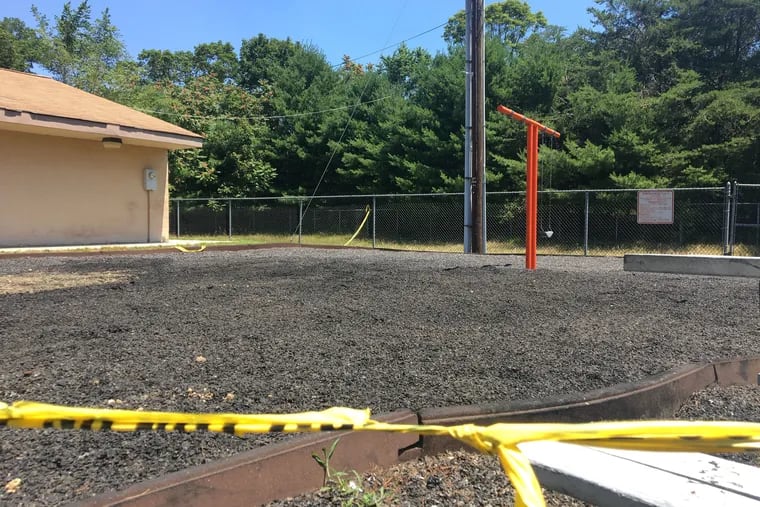 Yellow tape marks off the Bowen Recreational Center's playground, which was destroyed by a fire Saturday morning. Police are investigating the blaze, which they say may have been intentionally set.