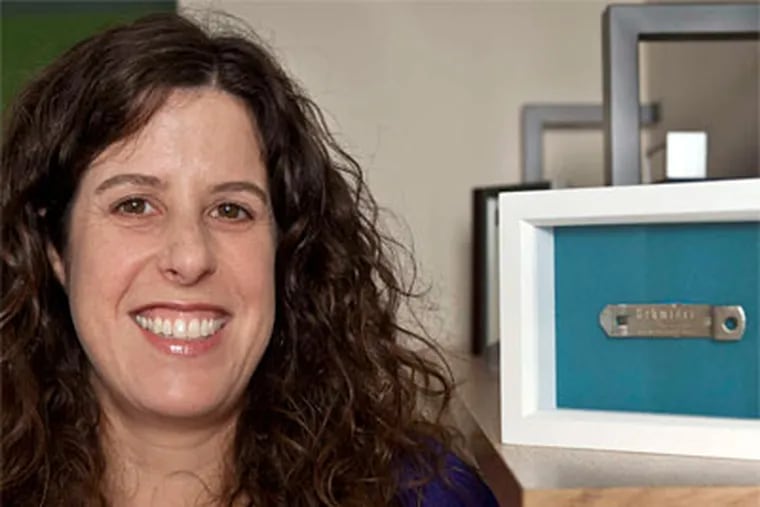 Sarah Rottenberg , who teaches design at Penn, framed the Schmidt's bottle opener. MICHAEL S. WIRTZ / Staff