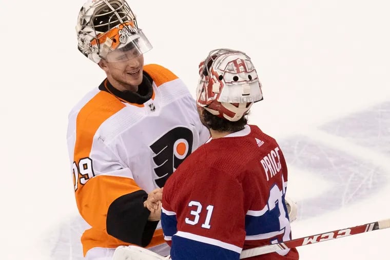 Canadiens goaltender Carey Price (right) congratulates Flyers goaltender Carter Hart after the Flyers beat the Canadiens, 3-2, on Friday night.