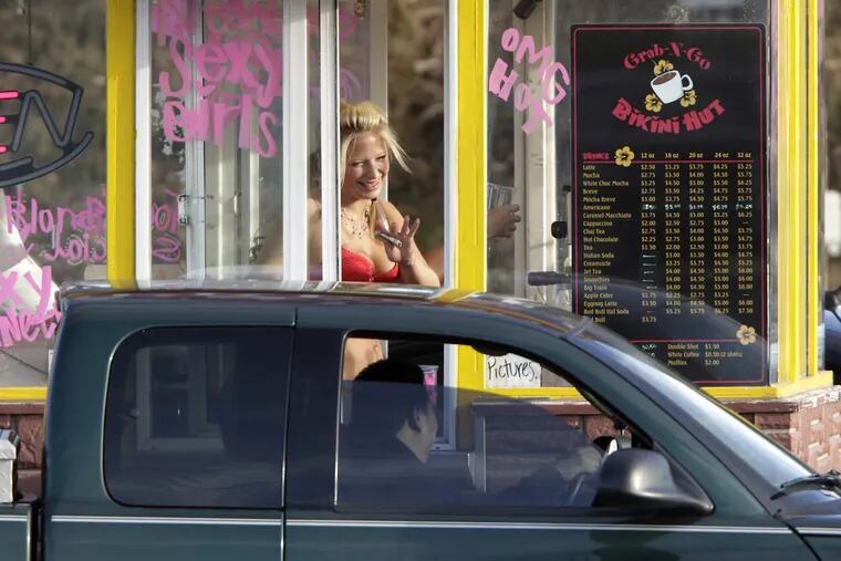 A barista at a Grab-N-Go Bikini Hut espresso stand in 2010 in Everett, Wash. The shop is linked to a suit against the city and to a sexual-exploitation conviction.