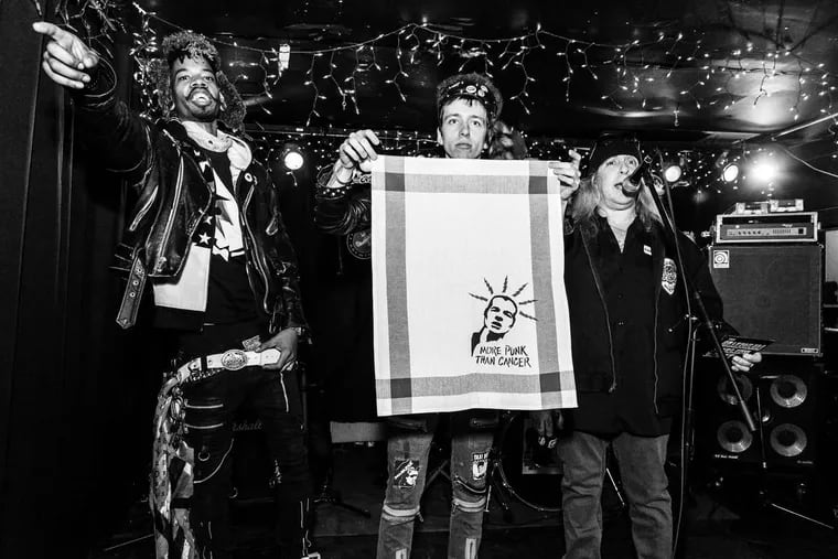 King Animal, Keith Richards McHugh, and Paul Bearer auction off a custom silk screened piece at A Valentine Benefit for Freddy Pompeii at Connie's Ric Rack. Credit: DAN E. LONG