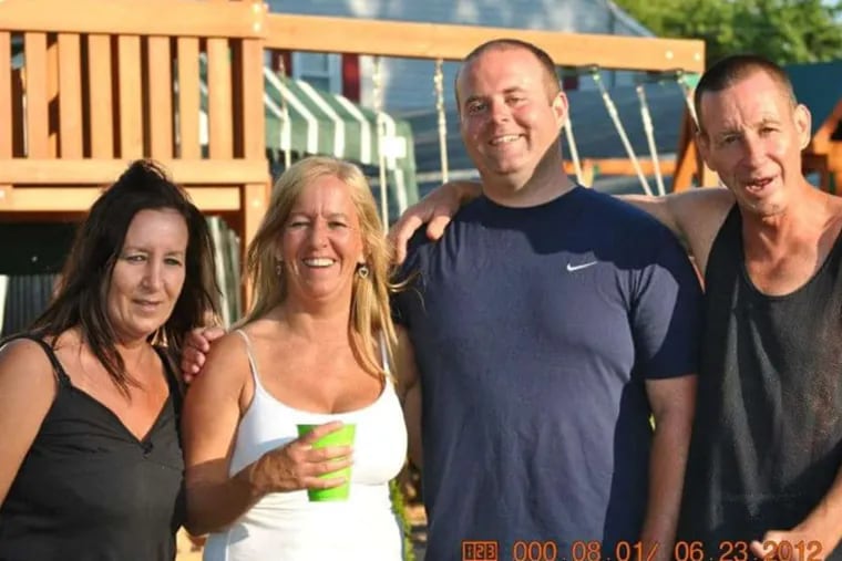Robert Barnes (far right) with his sisters (from left) Debbie Barnes and Diane Barnes and half-brother Steven Barnes at a family celebration in June 2012.