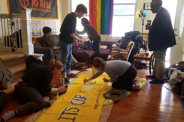 Members of Climate Strike Philly prepare for Friday's protests. They will rally twice, at LOVE Park and again at City Hall.