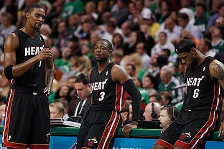Chris Bosh, Dwyane Wade and LeBron James will be in the spotlight as the 76ers face the Heat tonight. (Winslow Townson/AP)