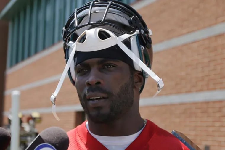 Eagles quarterback Michael Vick speaks to reporters after practice at the team's NFL football training facility, Friday, May 31, 2013, in Philadelphia. (Matt Rourke/AP)