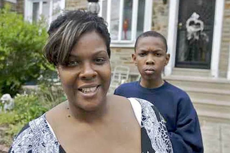Deserie Jones-Wright was able to keep her house thanks to the city's foreclosure-diversion program when she and her lender agreed to lower her mortgage rate. With her is son Jahbarie Francis, 11. (John Costello / Staff Photographer)