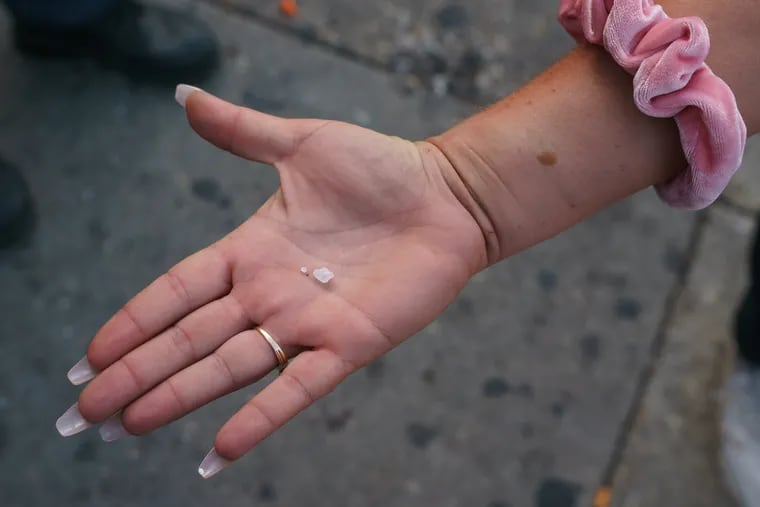 A woman shows an Inquirer reporter and photographer crystal meth near Kensington and Allegheny Avenues, a street corner known to be at the center of the opioid epidemic in Philadelphia.