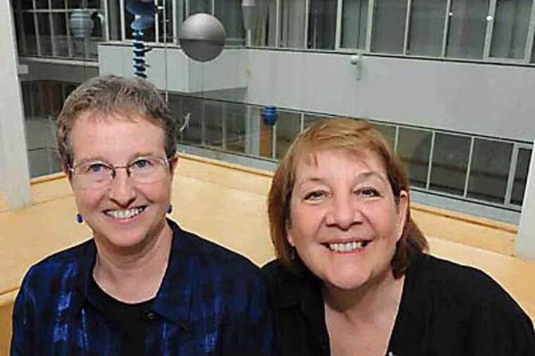 Karin McGowan (left) and Pat James at Children's Hospital of Philadelphia, where McGowan is director of microbiology. (Clem Murray  / Staff Photographer)