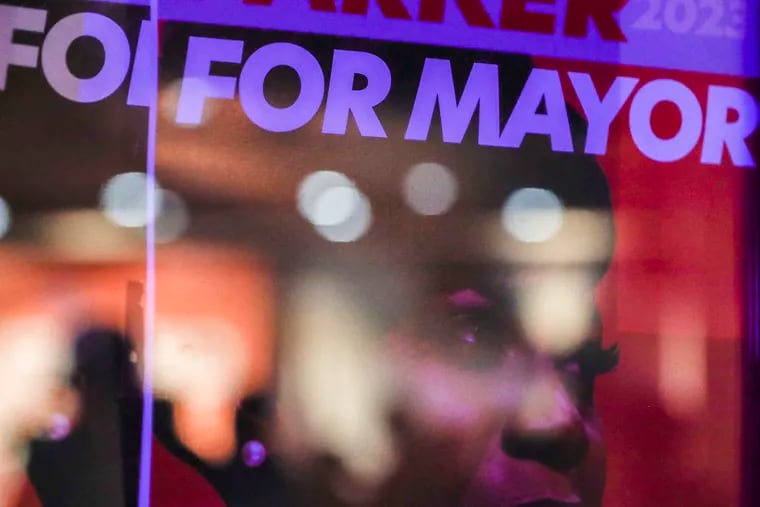 Supporters of Democratic candidate for mayor Cherelle Parker can be seen reflected in her campaign poster during her watch party at Laborers 332 in Philadelphia on Tuesday, May 16, 2023.
