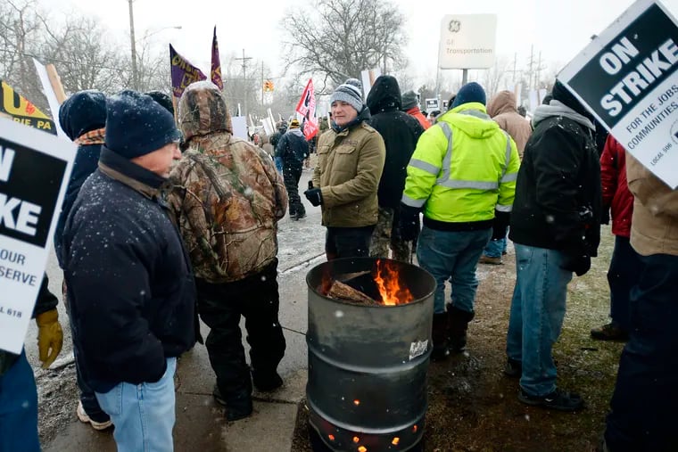 Wabtec Corp. employees, who are members of UE Local 506, strike near the west gate of the former GE Transportation plant, now owned by Westinghouse Airbrakes Technologies Corp.,  in Lawrence Park Township, Erie County, Pa., on Tuesday, Feb. 26, 2019. Leaders of UE Locals 506 and 618 said in a statement that they were unable to convince the company to negotiate what they called an "acceptable short term agreement that preserves the wages, benefits, and working conditions" for more than 1,000 employees.