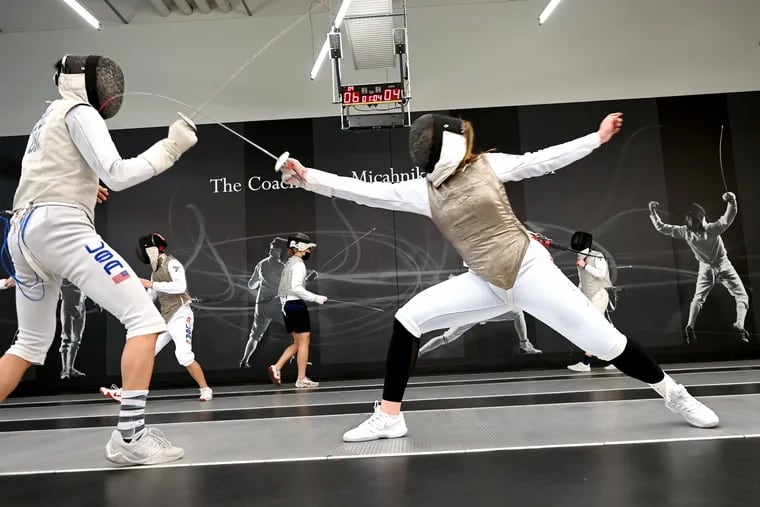 February 21, 2022: University of Pennsylvania fencing team foil members Bryce Louie (left) and Katina Proestakis Ortiz practice at Penn's Tse Ping-Cheng Cheung Ling Sports Center. Penn fencers will make their final appearance before the March NCAA tournament at the Temple Invitational on Feb. 27.