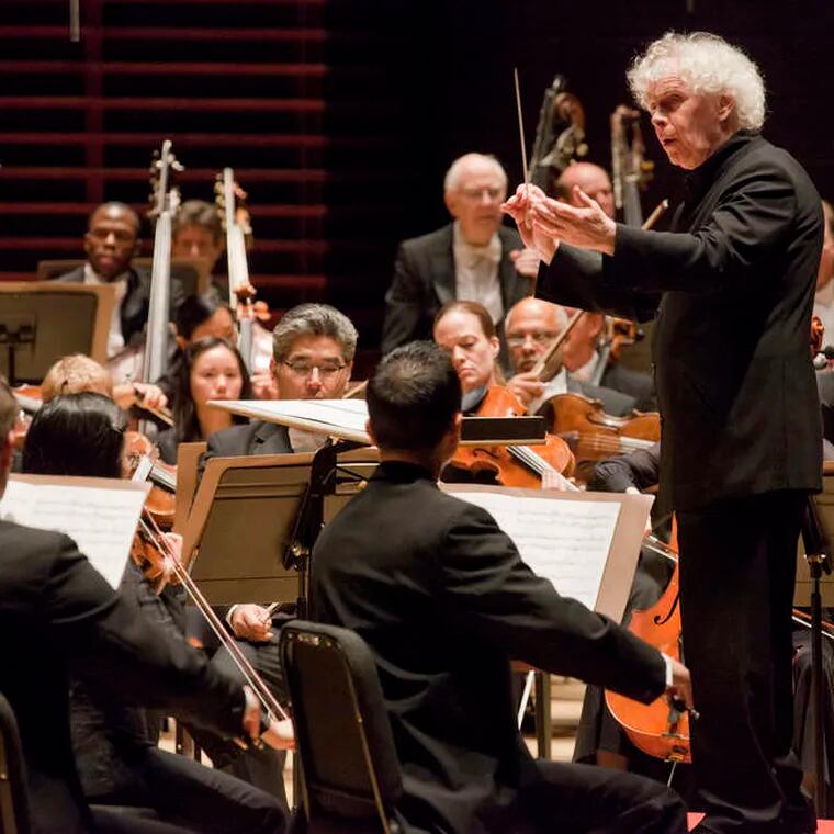 Simon Rattle conducting the Philadelphia Orchestra on Thursday. Pianist Lang Lang was guest soloist. As a curtain-raiser, Rattle used "Unstuck," by composer Andrew Norman. JESSICA GRIFFIN / Staff Photographer