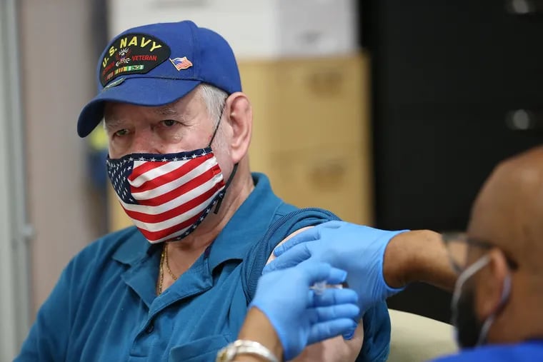 Vietnam veteran Herbert Garner receives the COVID-19 vaccine at a vaccine clinic at the Veterans Affairs hospital in Philadelphia.