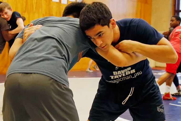 Central wrestler Zach Robles (right) spars with a teammate during practice.