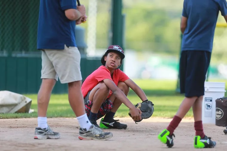 Mo'ne Davis of Taney Dragons practices with her team at the Little League World Series in South Williamsport, Pa., Thursday August 14, 2014. ( DAVID SWANSON / Staff Photographer )