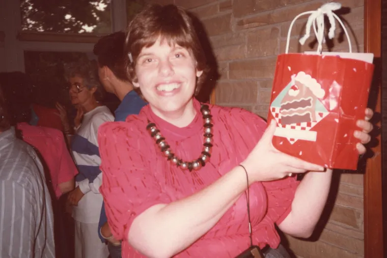 Ms. Abelson, ever the creative gift giver, holds a gift bag at one of her many events.