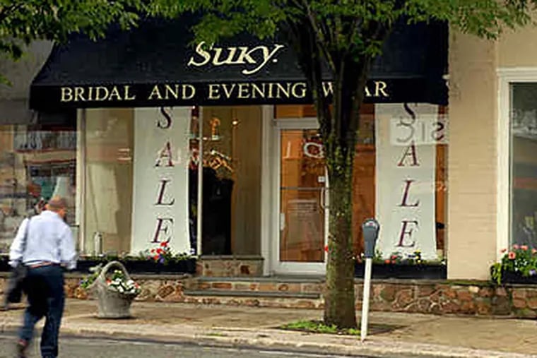 After decades of selling couture dresses on Lancaster Avenue in Bryn Mawr, Suky Rosan closes Friday. (Tom Gralish / Staff)