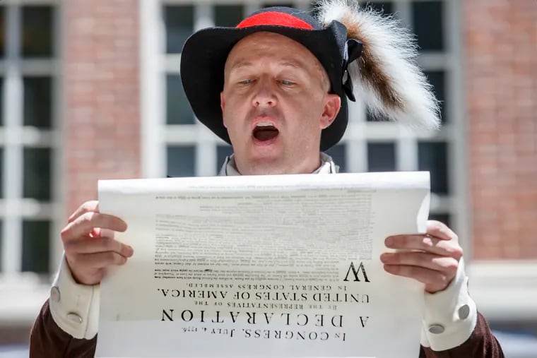 Dave Powers, an Independence Hall Park Ranger, reads the Declaration of Independence to a large crowd gathered behind Independence hall on Sunday July 8, 2018, on the 242nd anniversary of the first public reading of the historic document.