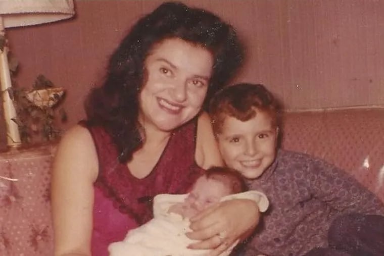 Ms. Cukier smiles with her son Curt and daughter Nanette in 1963.
