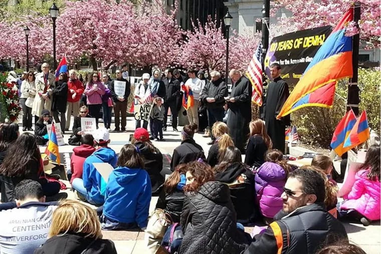 Protesters stage a 100-minute silent sit-in at LOVE Park on Friday to mark 100 years since the genocide of Armenians at the hands of the Ottoman Empire during World War I.