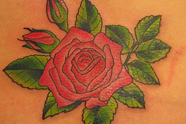 File photo of a rose tattoo. (Shannon Archuleta / Flickr)