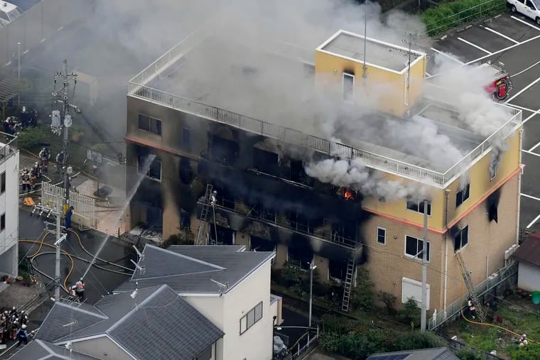 Smoke billows from a three-story building of Kyoto Animation in a fire in Kyoto, western Japan, on Thursday.