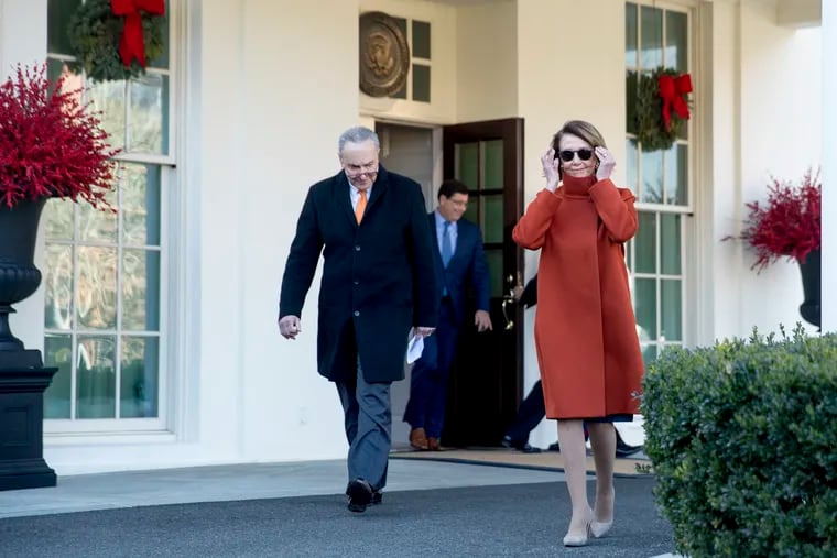 House Minority Leader Nancy Pelosi of Calif., right, and Senate Minority Leader Sen. Chuck Schumer of N.Y., left, walk out of the West Wing to speak to members of the media outside of the White House in Washington, Tuesday, Dec. 11, 2018, following a meeting with President Donald Trump. (AP Photo/Andrew Harnik)