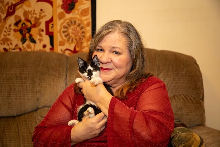 Robin Sipe and her new kitten, Earlene, at home in Grottoes, Va. MUST CREDIT: Bob Grebe
