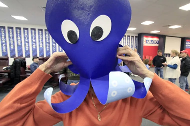 Rehearsing at Camden County Democratic headquarters, Harriet Friedner of Cherry Hill tries on her octopus hat. The Golden Schleppers are raising money for charity. (Elizabeth Robertson / Staff Photographer)