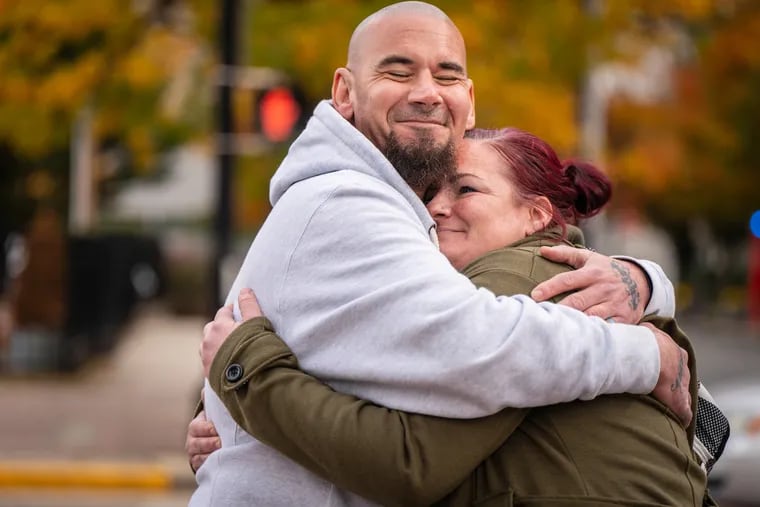 Kirk Stuart and Crystal Quigley, who were both incarcerated in the Camden County jail, hug near Cooper University Hospital in Camden. Stuart and Quigley both participated in addiction treatment programs in the jail and are now in recovery. A new report on the Camden jail's addiction treatment program shows that inmates who participated reduced their risk of overdose significantly for up to a year after their release.